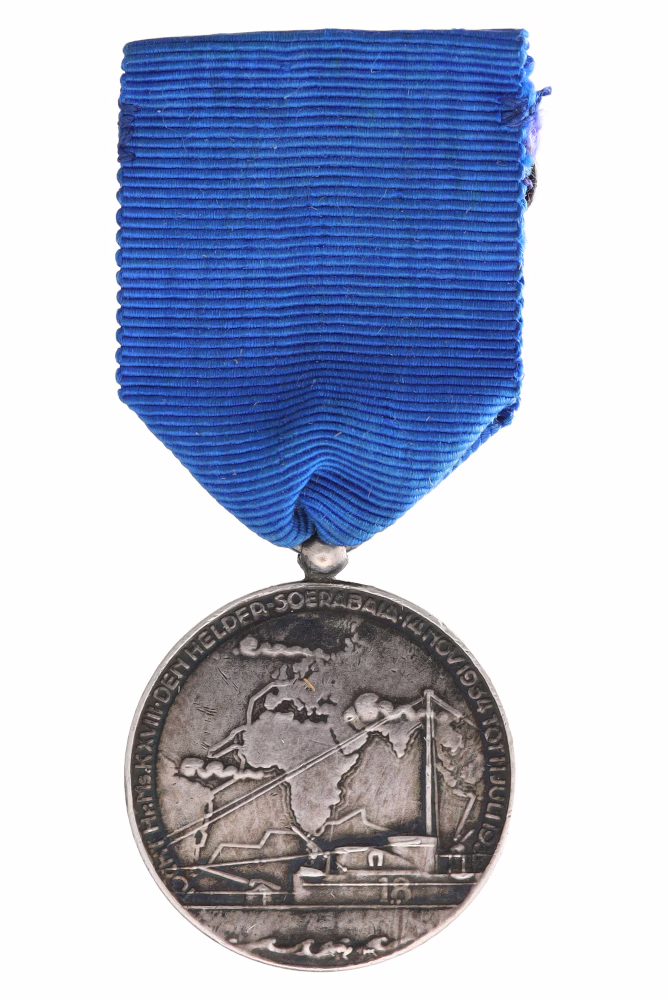 The Medal of the National Commission for Surveying and Levelling, 1935, awarded to the crew of the K-XVIII. Text on the front: VOYAGE HR MS K XVIII DEN HELDER SOERABAIA 14 NOV. 1934 11 JULY 1935