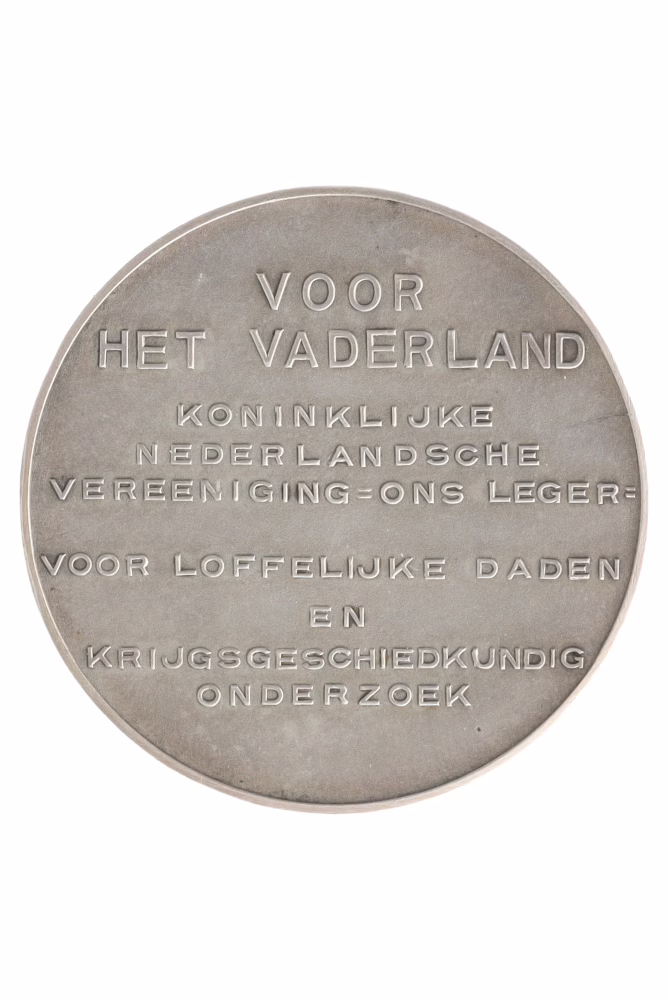 The silver Prince Maurits Medal, a military medal from 1936, reverse side bearing the inscription ‘FOR THE FATHERLAND ROYAL DUTCH ASSOCIATION = OUR ARMY FOR COMMENDABLE DEEDS AND MILITARY HISTORICAL RESEARCH’