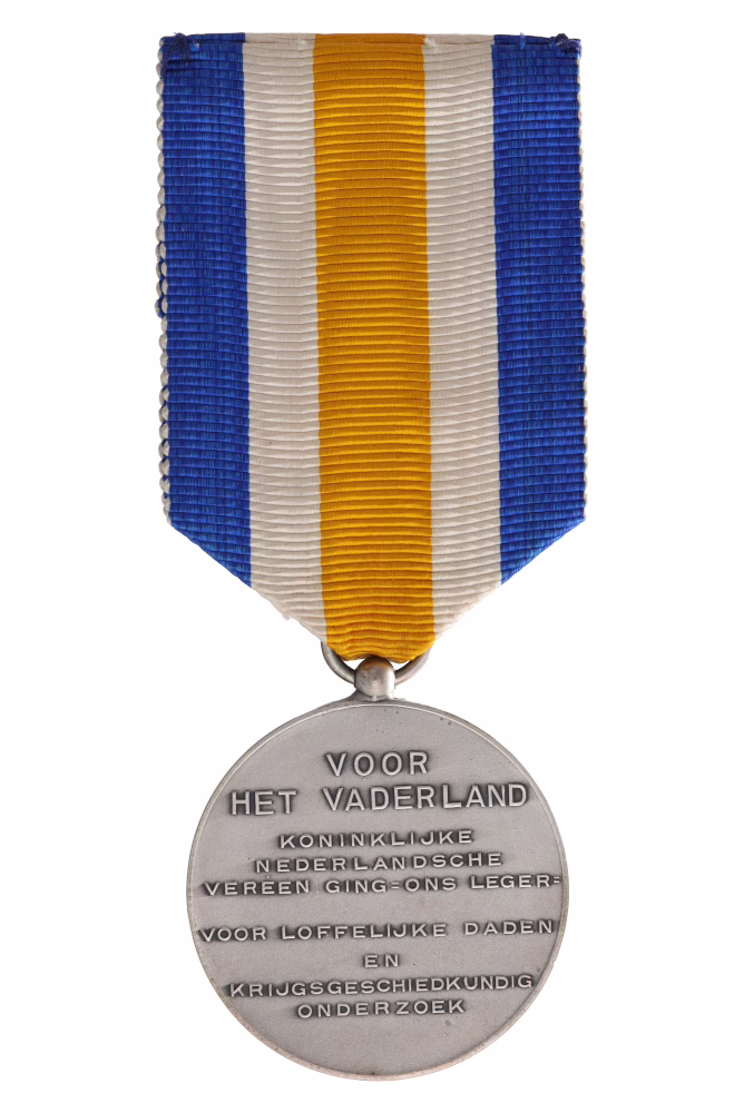 The Silver Prince Maurits Medal, a military decoration from 1936, reverse side bearing the inscription ‘FOR THE FATHERLAND ROYAL DUTCH ASSOCIATION = OUR ARMY FOR COMMENDABLE DEEDS AND MILITARY HISTORICAL RESEARCH’